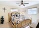 Comfortable bedroom with decorative furnishings, natural light, and a ceiling fan at 4 Windsor Dr, Englewood, FL 34223