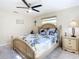 Relaxing bedroom featuring stylish decor, a ceiling fan, and natural light from the windows at 4 Windsor Dr, Englewood, FL 34223