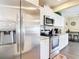 Kitchen boasts stainless steel appliances and granite countertops at 4 Windsor Dr, Englewood, FL 34223