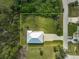 House and yard from above, showing a large grassy area at 4130 Rock Creek Dr, Port Charlotte, FL 33948
