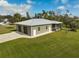 Single story home with attached two-car garage and backyard at 4130 Rock Creek Dr, Port Charlotte, FL 33948