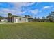 Single-story house with a screened patio and fenced yard at 4130 Rock Creek Dr, Port Charlotte, FL 33948