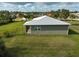 Single story house with gray siding and metal roof at 4130 Rock Creek Dr, Port Charlotte, FL 33948