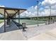 Community shuffleboard courts with covered spectator seating at 43 Castaway Ct, North Port, FL 34287