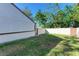 Private backyard with grassy area and wooden gate at 4417 Park Lake N Ter, Bradenton, FL 34209