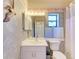 Clean bathroom with a white vanity and floral border at 4417 Park Lake N Ter, Bradenton, FL 34209
