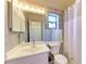 Clean bathroom with a white vanity and floral border at 4417 Park Lake N Ter, Bradenton, FL 34209