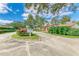 Landscaped entrance to community with signage and lush greenery at 4417 Park Lake N Ter, Bradenton, FL 34209