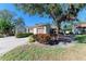 Front view of a house with two-car garage and lush landscaping at 4417 Park Lake N Ter, Bradenton, FL 34209