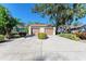 Two-car garage with driveway and mature trees at 4417 Park Lake N Ter, Bradenton, FL 34209