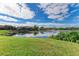 Serene lakefront view with lush landscaping at 4417 Park Lake N Ter, Bradenton, FL 34209