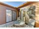Cozy patio with glass-top table and chairs, adjacent to kitchen at 4417 Park Lake N Ter, Bradenton, FL 34209