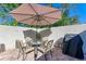 Cozy patio seating area with umbrella and grill at 4417 Park Lake N Ter, Bradenton, FL 34209