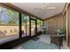 Relaxing screened porch with wicker chairs and patio view at 4417 Park Lake N Ter, Bradenton, FL 34209