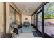Relaxing screened porch with wicker furniture and ceiling fan at 4417 Park Lake N Ter, Bradenton, FL 34209