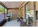 Spacious screened porch with wicker chairs and access to patio at 4417 Park Lake N Ter, Bradenton, FL 34209