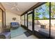 Bright screened porch features view of patio and trees at 4417 Park Lake N Ter, Bradenton, FL 34209