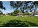 Relaxing park with a gazebo, lush green grass, and benches at 504 Narvaezi St # 119, Venice, FL 34285