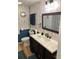 Bathroom with vanity and patterned wallpaper at 513 Cervina N Dr, Venice, FL 34285