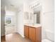 Clean bathroom with wood vanity and updated fixtures at 5198 Layton Dr, Venice, FL 34293