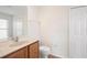 Clean bathroom with toilet, vanity, and walk-in closet at 5198 Layton Dr, Venice, FL 34293