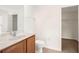 Clean bathroom with toilet, vanity, and walk-in closet at 5198 Layton Dr, Venice, FL 34293