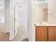 Bathroom with vanity and view into bedroom at 5198 Layton Dr, Venice, FL 34293