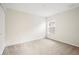 Bright bedroom with neutral carpeting and large window at 5198 Layton Dr, Venice, FL 34293