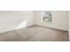 Well-lit bedroom with neutral wall-to-wall carpeting and window coverings at 5198 Layton Dr, Venice, FL 34293