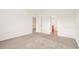 Large bedroom with neutral carpeting and access to a bathroom at 5198 Layton Dr, Venice, FL 34293