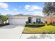 One-story house with a two-car garage and landscaped yard at 5198 Layton Dr, Venice, FL 34293