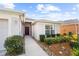 Front entrance of a house with walkway and neatly trimmed bushes at 5198 Layton Dr, Venice, FL 34293