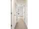 Hallway with carpet and doors to bedrooms at 5198 Layton Dr, Venice, FL 34293