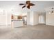 Bright and spacious living room with neutral carpeting and ceiling fan at 5198 Layton Dr, Venice, FL 34293