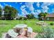 Stone picnic table and benches in grassy area at 5198 Layton Dr, Venice, FL 34293