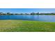 Scenic view of a tranquil lake surrounded by waterfront homes at 5372 Oakmont Ct, North Port, FL 34287