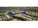 Stunning aerial view of a community with waterfront homes, canals, and lush landscaping at 5856 Helicon Pl, Sarasota, FL 34238