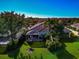 Aerial view of a home with a private screened patio and lush green lawn at 5856 Helicon Pl, Sarasota, FL 34238