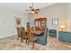 Dining area with a wood table, seating for six, and a china cabinet at 5856 Helicon Pl, Sarasota, FL 34238