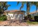 Front exterior of the house featuring the garage and driveway at 5856 Helicon Pl, Sarasota, FL 34238