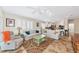 Comfortable living area with tile floors, vaulted ceiling, and access to the kitchen at 5856 Helicon Pl, Sarasota, FL 34238