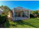 Backyard with screened patio, perfect for outdoor relaxation at 5856 Helicon Pl, Sarasota, FL 34238