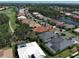 Aerial view of a residential neighborhood with pristine landscaping and golf course views at 589 Pond Willow Ln, Venice, FL 34292