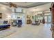 Open-concept living space featuring a kitchen, living room, dining area, and elegant design elements at 589 Pond Willow Ln, Venice, FL 34292