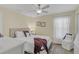 Bedroom with a king-size bed, ceiling fan, and tiled floor at 6297 Drucker Cir, Port Charlotte, FL 33981
