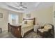 Bedroom with a king-size bed and ceiling fan at 6297 Drucker Cir, Port Charlotte, FL 33981