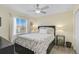 Comfortable bedroom with a floral bedspread and window seating at 6297 Drucker Cir, Port Charlotte, FL 33981