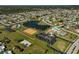 Aerial view of community tennis courts and surrounding area at 6297 Drucker Cir, Port Charlotte, FL 33981