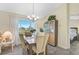Charming dining area with window views and wood table set at 6297 Drucker Cir, Port Charlotte, FL 33981