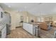Open concept kitchen with island and views into living room at 6297 Drucker Cir, Port Charlotte, FL 33981
